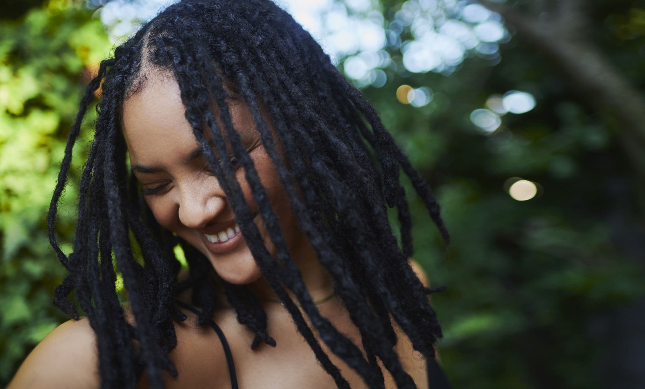 A Full Guide To Invisible Locs: Everything To Know About The Popular Hairstyle