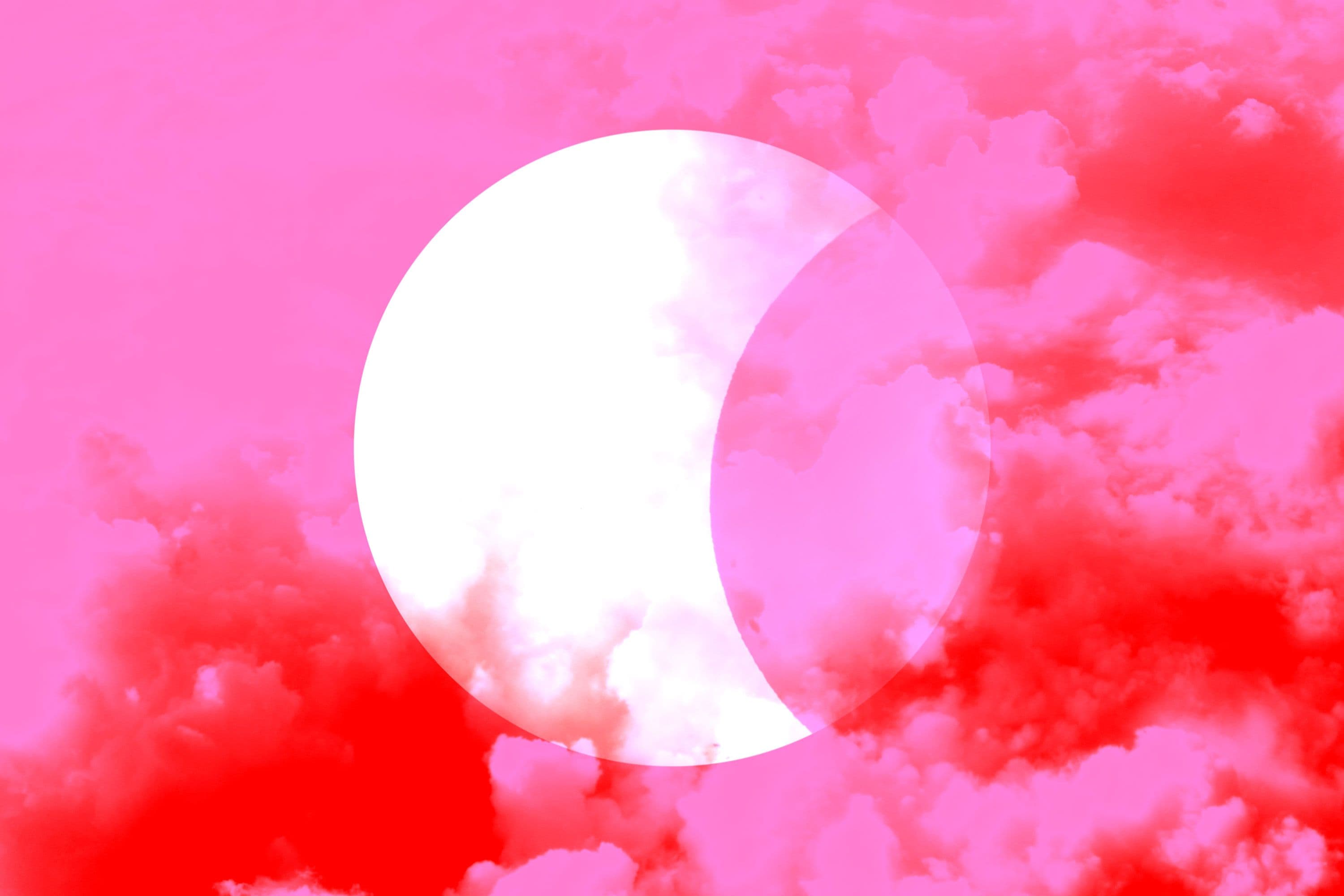 A Harvest Moon, Blood Moon, & Partial Lunar Eclipse Are Happening Tonight: What That Means, Per Astrologers